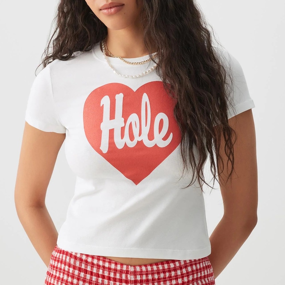 Ardene Hole Baby T size medium
